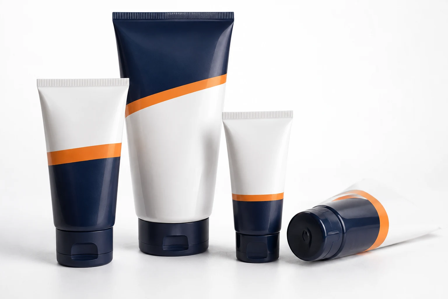 Real custom printed plastic lubricant tubes in a studio arrangement